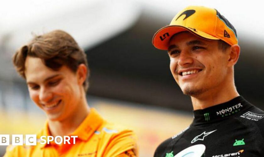 Lando Norris of Great Britain and McLaren smiles with team mate Oscar Piastri of Australia