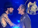 Moment lead singer of iconic rock band Jane's Addiction explodes onstage, punches guitarist mid-song