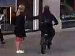 Moment thief on an e-bike snatches mobile from woman on Oxford Street as London's phone theft epidemic claims yet another victim