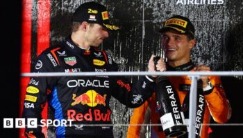 Max Verstappen congratulates Singapore Grand Prix winner Lando Norris on the podium