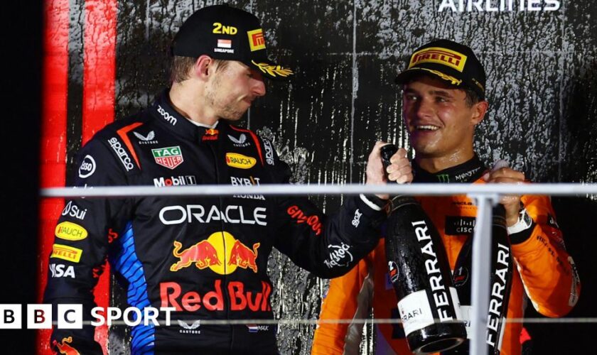 Max Verstappen congratulates Singapore Grand Prix winner Lando Norris on the podium