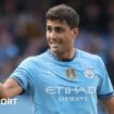 Rodri holds his hands to his face during a press conference