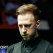 Judd Trump lines up a shot in snooker