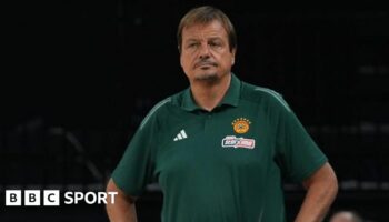 Ergin Ataman wearing a green t-shirt