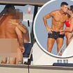 What's happening below deck? Cristiano Ronaldo appears to miss the REAL action as naked couple sail by his superyacht amid holiday with Georgina Rodriguez