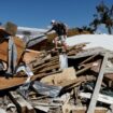 A man who lives in Keaton Beac, works to recover his belongings from his home after Hurricane Helene passed through the Florida panhandle. Pic: Reuters