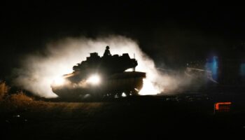 An Israeli tank manoeuvres near the Israel-Lebanon border Pic: AP