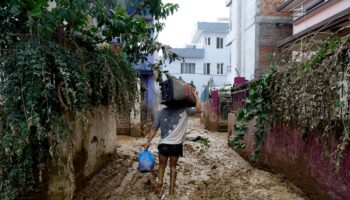 Rescuers search for people still missing in Nepal after flooding and landslides that killed 217