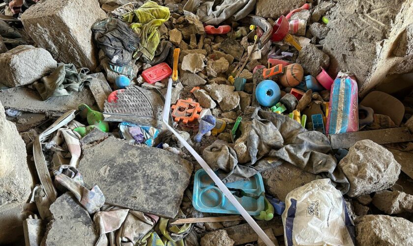 Children's toys in rubble of deadly apartment block strike