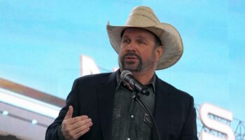 FILE - Garth Brooks speaks during a groundbreaking ceremony for the Tennessee Titans new NFL football stadium, Feb. 29, 2024, in Nashville, Tenn. (AP Photo/George Walker IV, File)