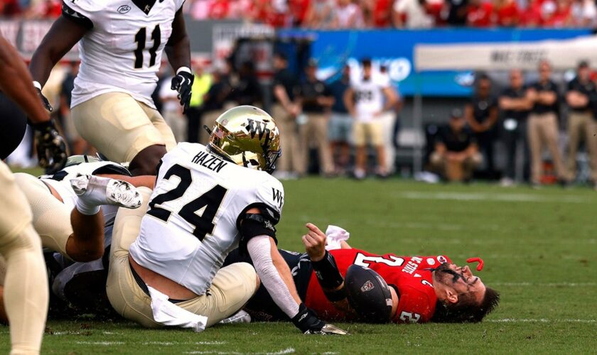 NC State quarterback Grayson McCall carted off the field after scary hit sends helmet flying