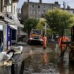 Workers clear mud from the street, in Annonay, central France, on October 18, 2024, the day after the city was stuck by floods.Des agents nettoyent les rues d'Annonay, en Ardèche, au lendemain des inondations qui ont frappé la ville, le 18 octobre 2024