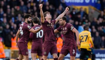 John Stones strikes late as Man City beat Wolves with controversial goal