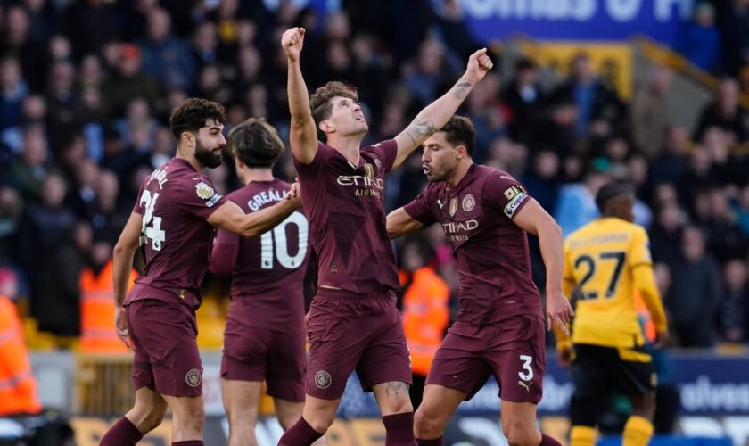 John Stones strikes late as Man City beat Wolves with controversial goal