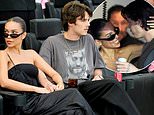 Cruz Beckham, 19, appears smitten with girlfriend Jackie Apostel, 29, as the pair join his sister Harper and mum Victoria to support football club owner dad David at Inter Miami