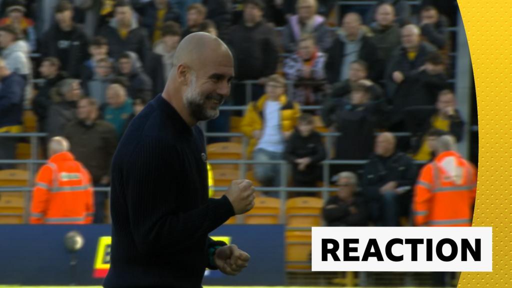 Pep Guardiola celebrates Manchester City's goal