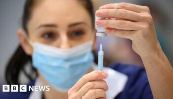 A woman receives the Covid vaccine