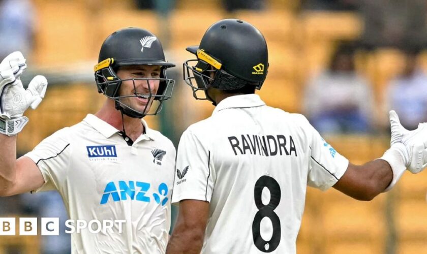 New Zealand batters Will Young and Rachin Ravindra celebrate victory in India