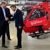 Prince of Wales is joined by David Beckham in the cockpit of a helicopter as he visits the Air Ambulance Charity