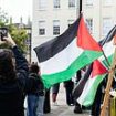 Pro-Palestinian protesters begin London march a year after October 7 attacks as police warn they'll arrest anyone showing support for Hamas or Hezbollah