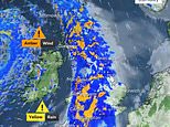 Storm Ashley barrels into Britain bringing 80mph winds and pounding rain as Met Office issues weather alerts and dozens of flood warnings issued