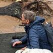 Tragic final photo of grandparents perched on roof of flooded Asheville home before they were swept away with grandson