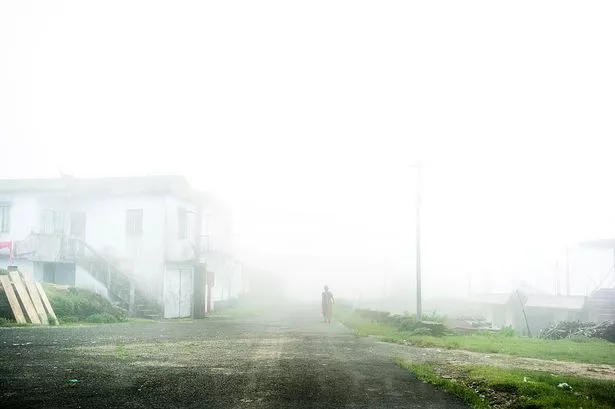 World's wettest town where people wear full body umbrellas and soundproof homes