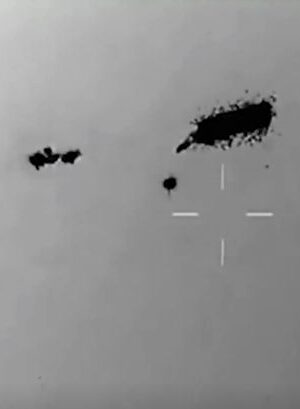 Jaw-dropping video shows swarm of UFOs 'completely unaffected' by missile attack