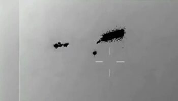 Jaw-dropping video shows swarm of UFOs 'completely unaffected' by missile attack