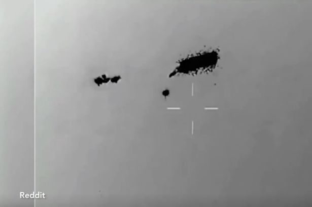 Jaw-dropping video shows swarm of UFOs 'completely unaffected' by missile attack