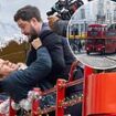 Kit Harington STRANGLES Mark Wahlberg in new role as knife-wielding maniac as they shut down London’s historic Whitehall for action packed bus-top brawl while filming The Family Plan 2